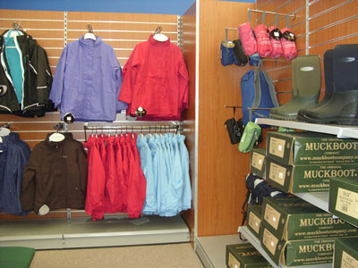 Retail shop shelving with slatwall and garment displays